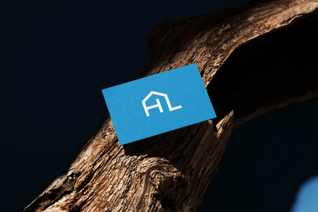Mockup von Visitenkarte in blau mit weißen HL Icon
